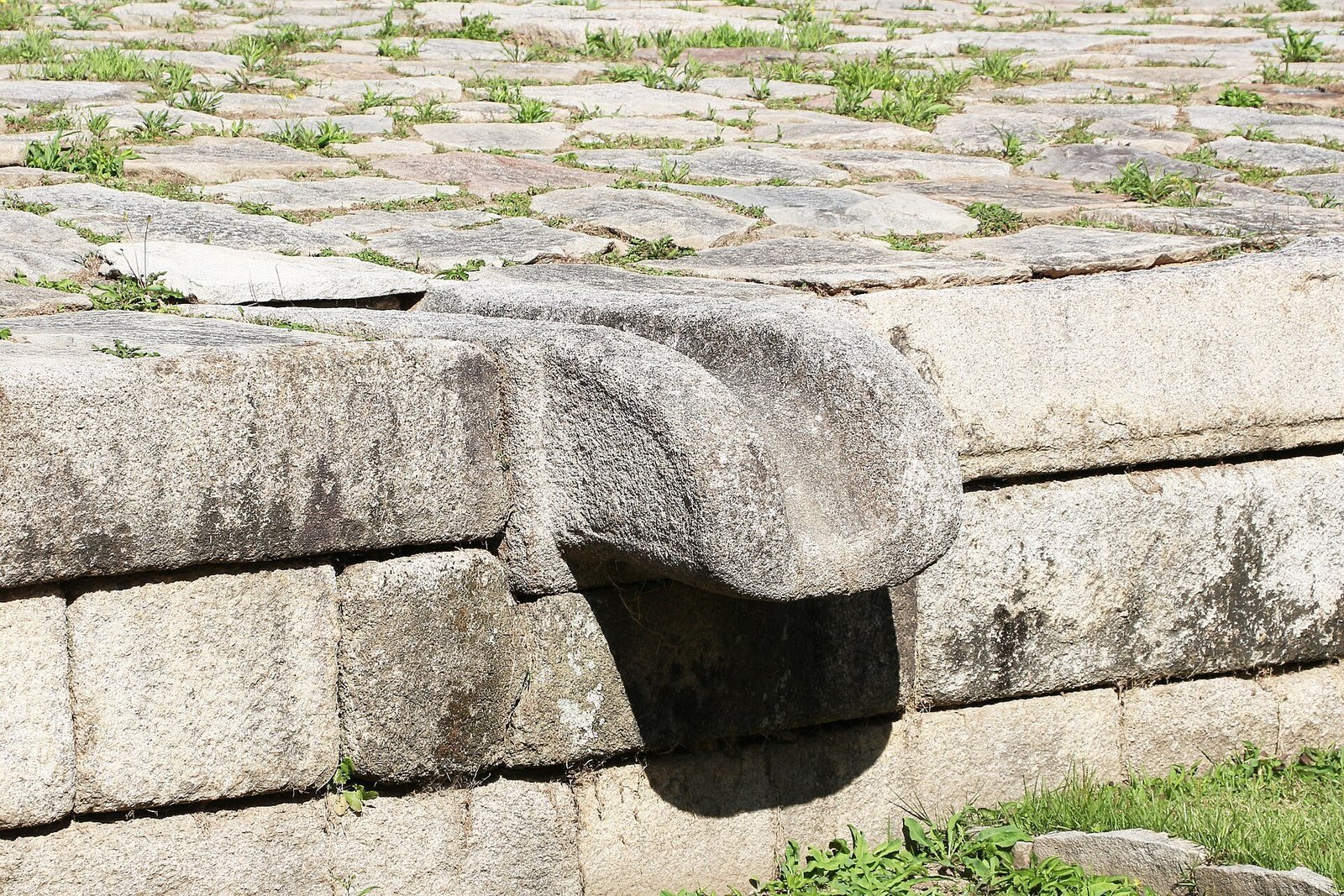 Stone drain spout on the courtyard platform of Jongmyo