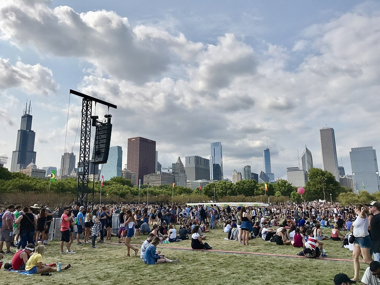 Lollapalooza festival crowd with the Chicago skyline - KickFlip played Lollapalooza in 2025 (festival photo from 2017)