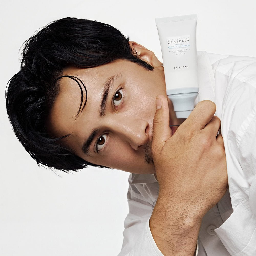 SKIN1004 official campaign model holding Hyalu-Cica Water-Fit Sun Serum UV